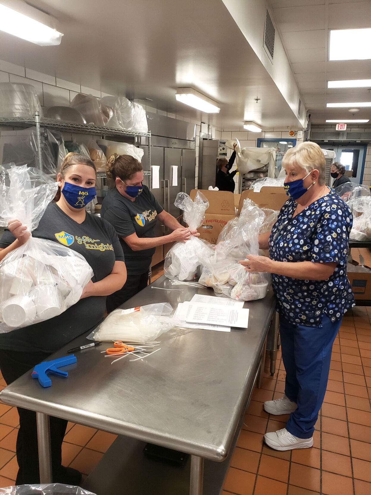 MM nutrition services staff with meals